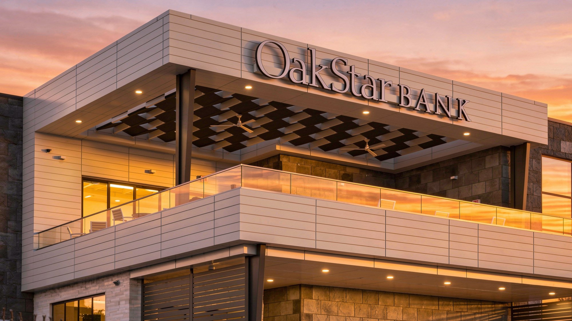 OakStar Bank at sunset, with a tensioned fabric shade lattice over its rooftop patio